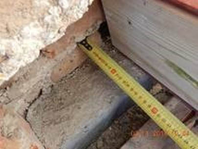 close up image of cutting into party wall with padstone and steel beam