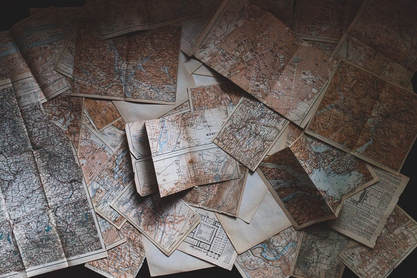 different maps scattered on the floor